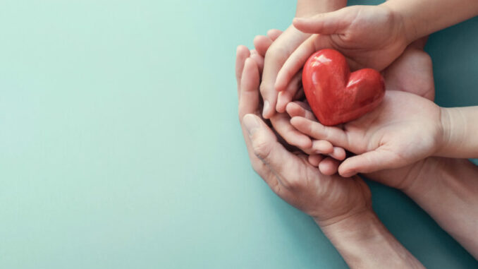 Family,Hands,Holding,Red,Heart,,Heart,Health,Insurance,,Organ,Donation,